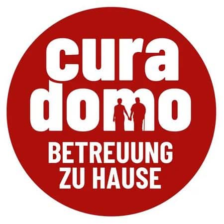 meinkarrierestart.at Roter Kreis mit weißem Text „cura domo BETREUUNG ZU HAUSE“ und Silhouetten von zwei Menschen, die sich an den Händen halten.